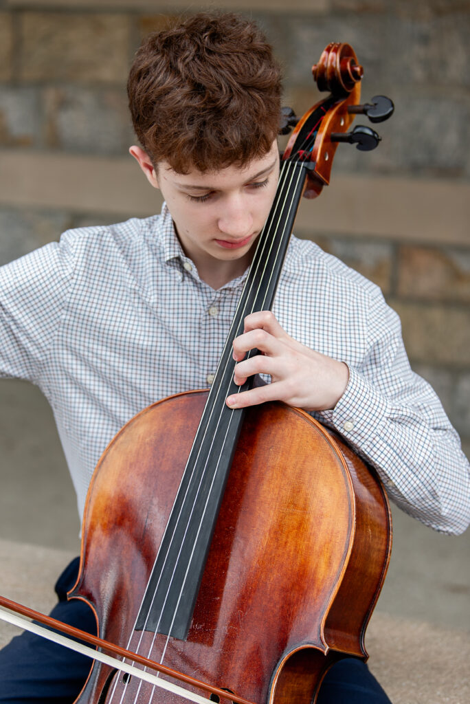 Teenage boy playing the cello