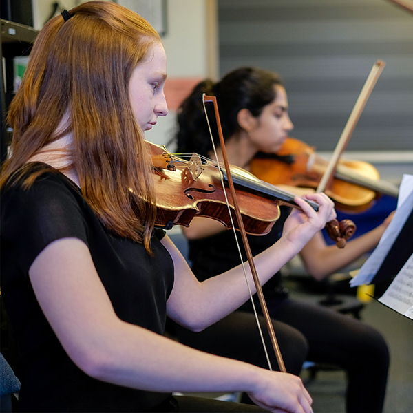 Girls playing violins