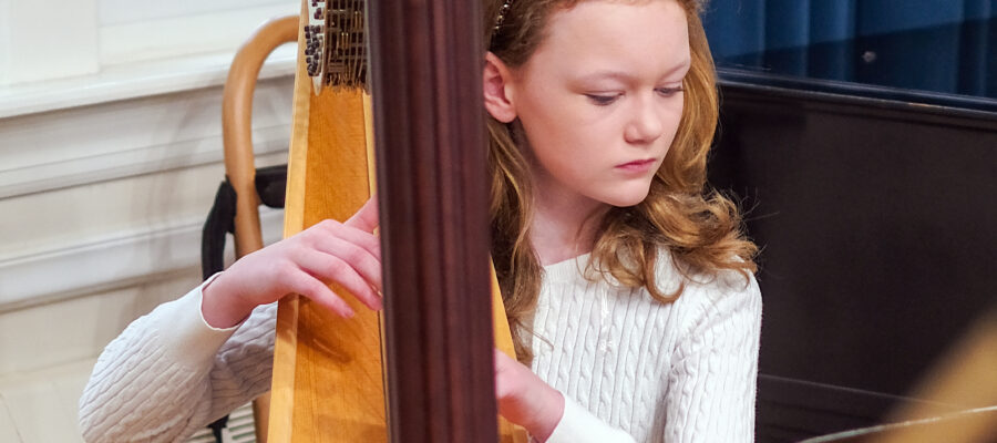 Girl playing the harp