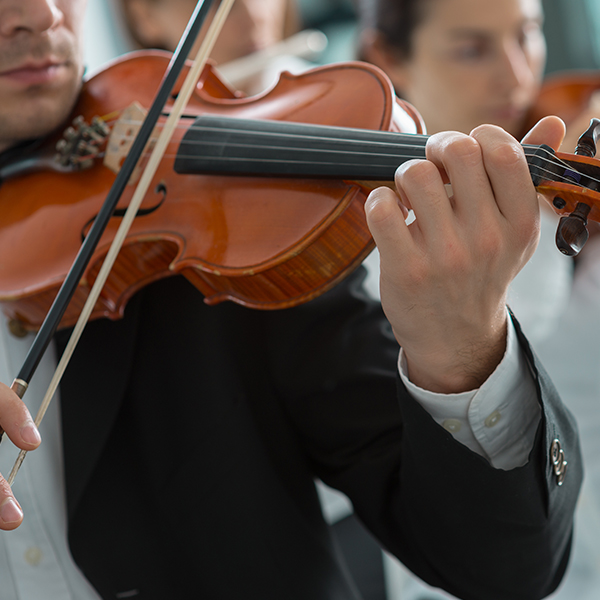Close up of violin players